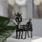 Design Skulptur "Familie auf Bank" 16cm aus Eisen brüniert