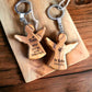 Schlüsselanhänger Engel 5 cm aus Olivenholz personalisiertes Geschenk